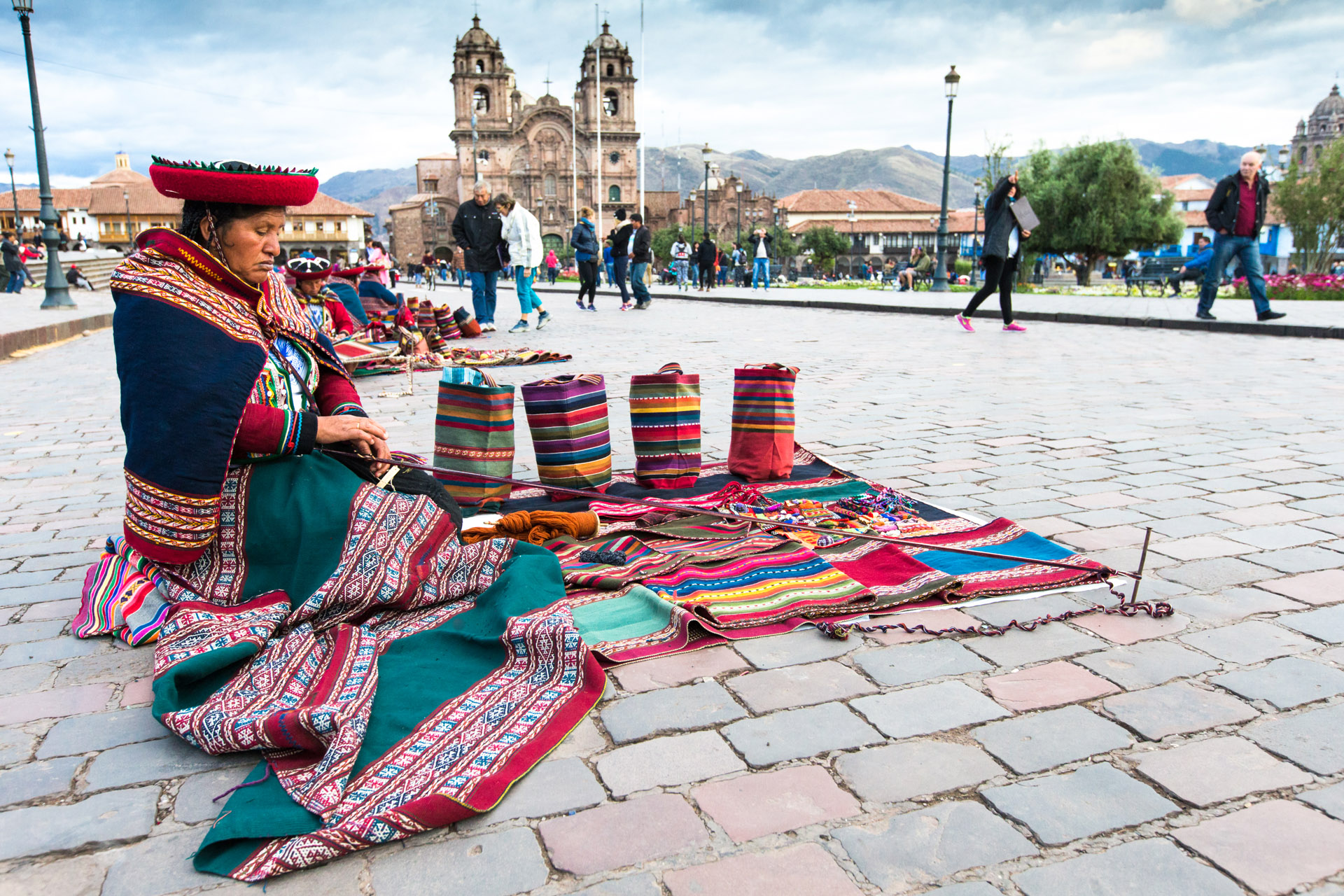 Peru Nov. 9 2015: Unidentified native weavers, dressed in traditional clothing, demonstrate their handicraft. Cusco.